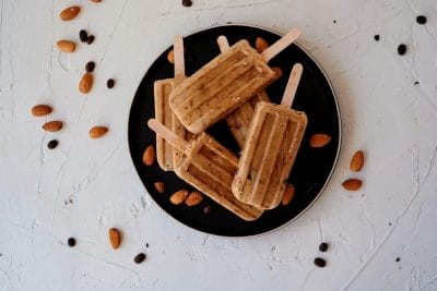 caffeine popsicles with almond and chocolate on plate