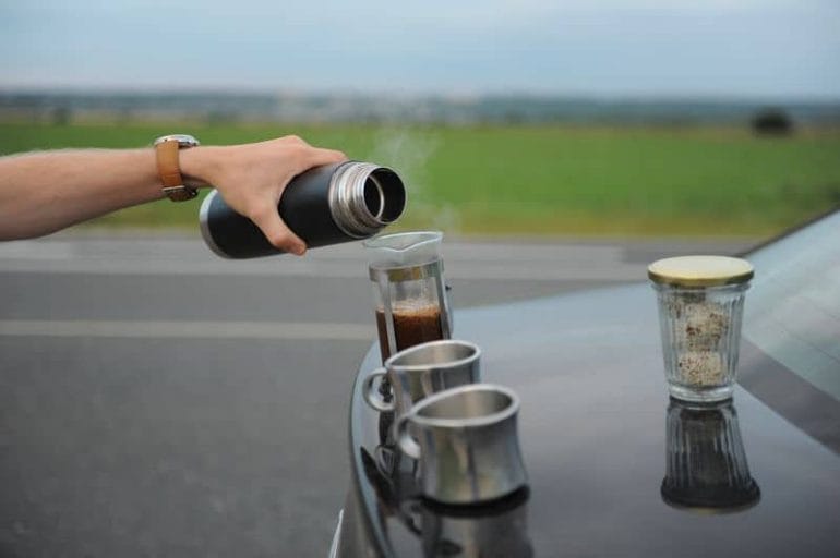 Travel Coffee Press on boot of car
