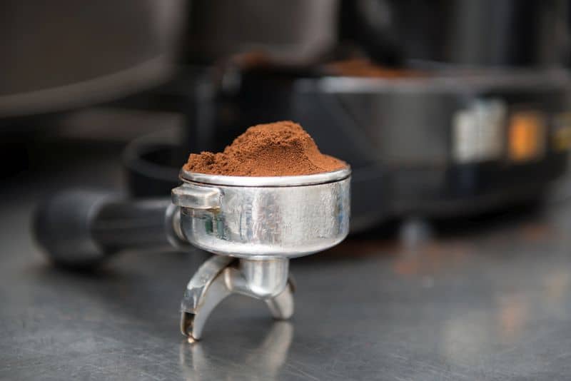 Selected focus on the ground coffee in portafilter