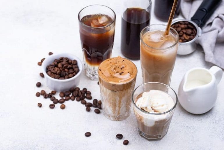 different kinds of iced coffee drinks on table