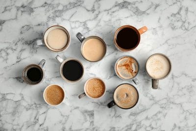 different types of coffee drinks on table