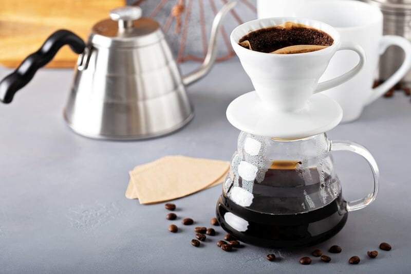 Pour over coffee being made with a kettle and glass carafe