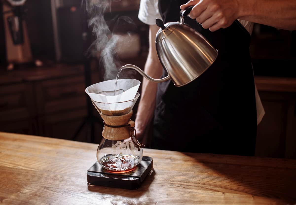 using a chemex pour over coffee maker and gooseneck kettle.