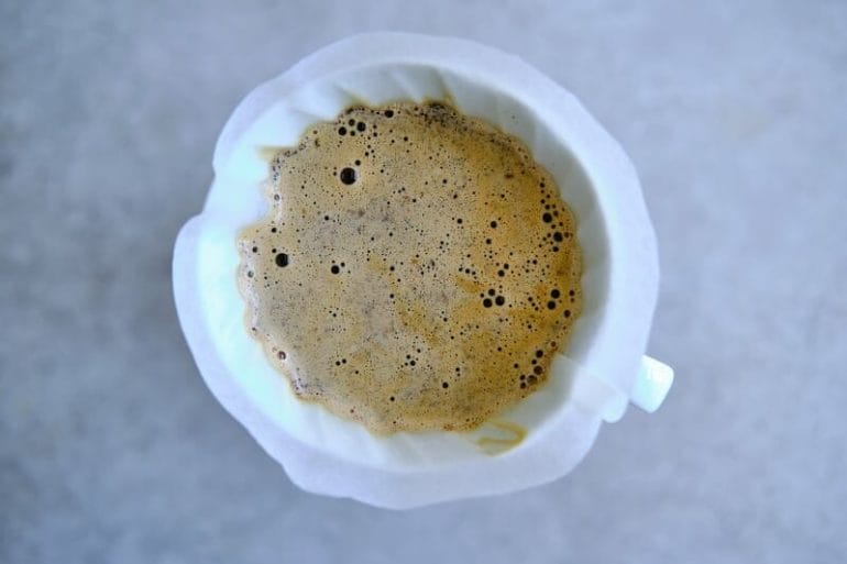 Brewing pour over coffee with a coffee dripper.