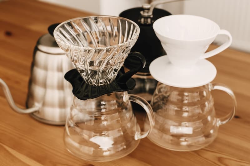 Alternative coffee brewing method. Glass carafe with plastic and ceramic dripper for pour-over coffee with a filter dripper.