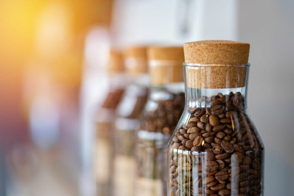 coffee beans stored in glass coffee container