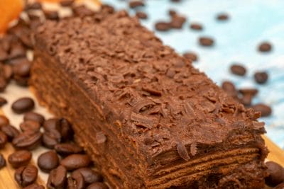 chocolate coffee cake surrounded by coffee beans.