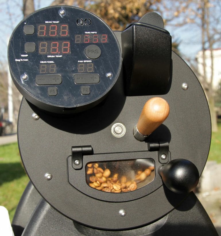 Home coffee roaster machine roasting freshly roasted coffee beans