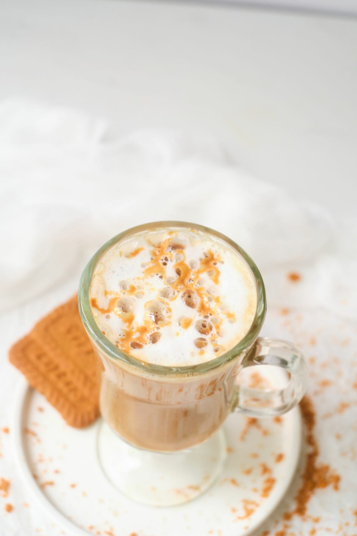 Hot coffee drink in glass mug.