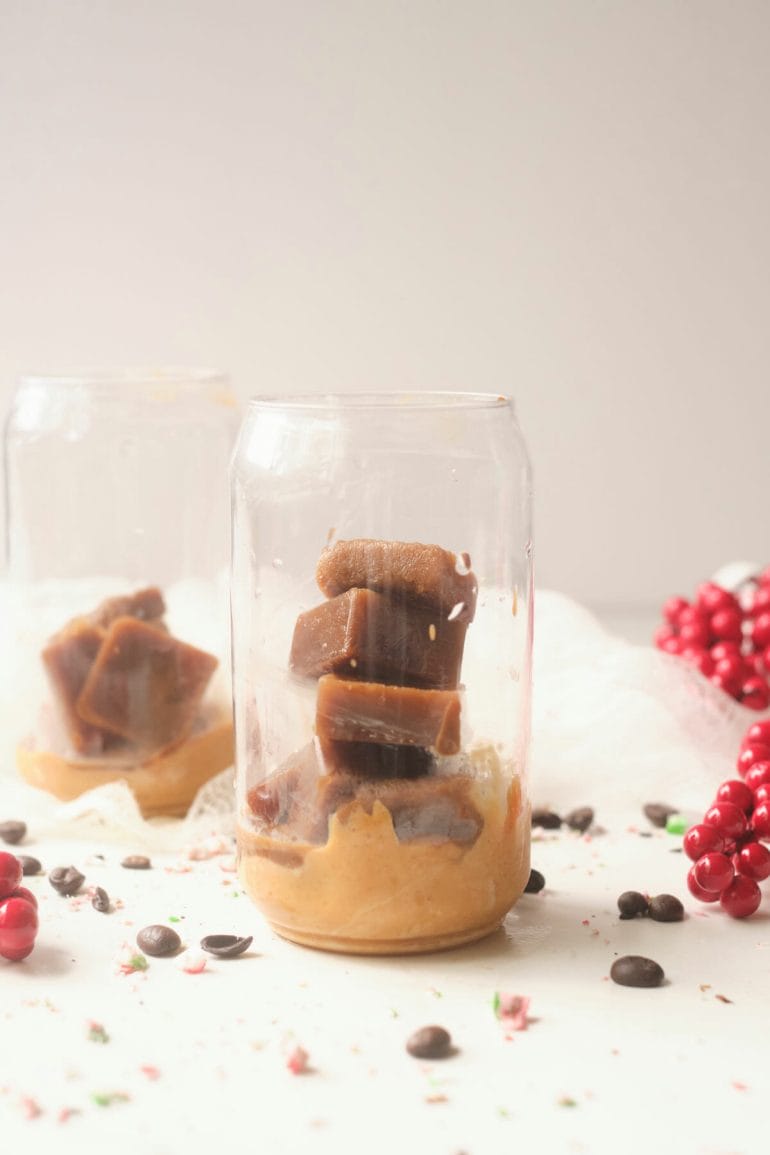 dulce de leche and coffee ice cubes in glass.