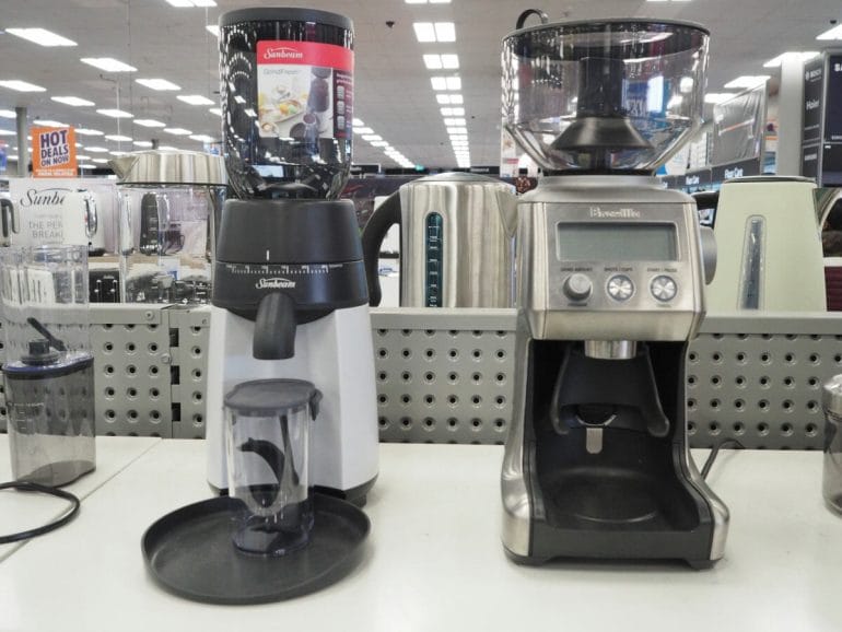 Sunbeam and Breville coffee grinder side by side in retail store.
