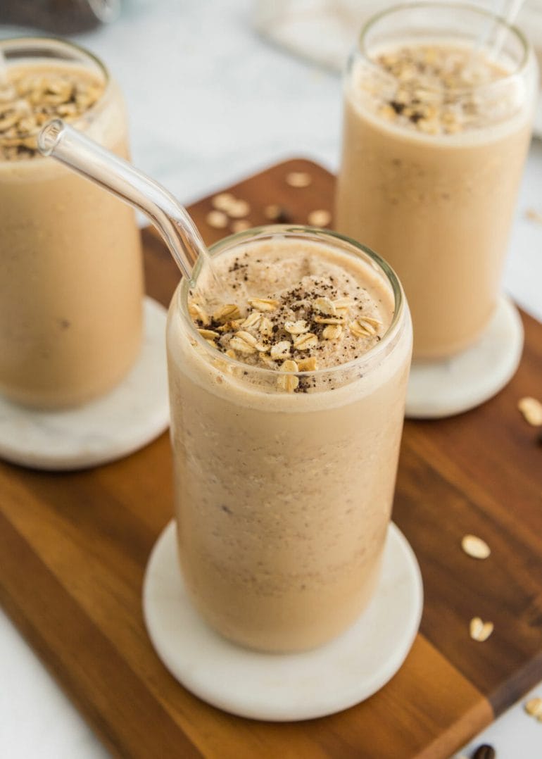 coffee date smoothie in glass on wooden board.